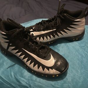 Size 4 youth Nike football cleats.